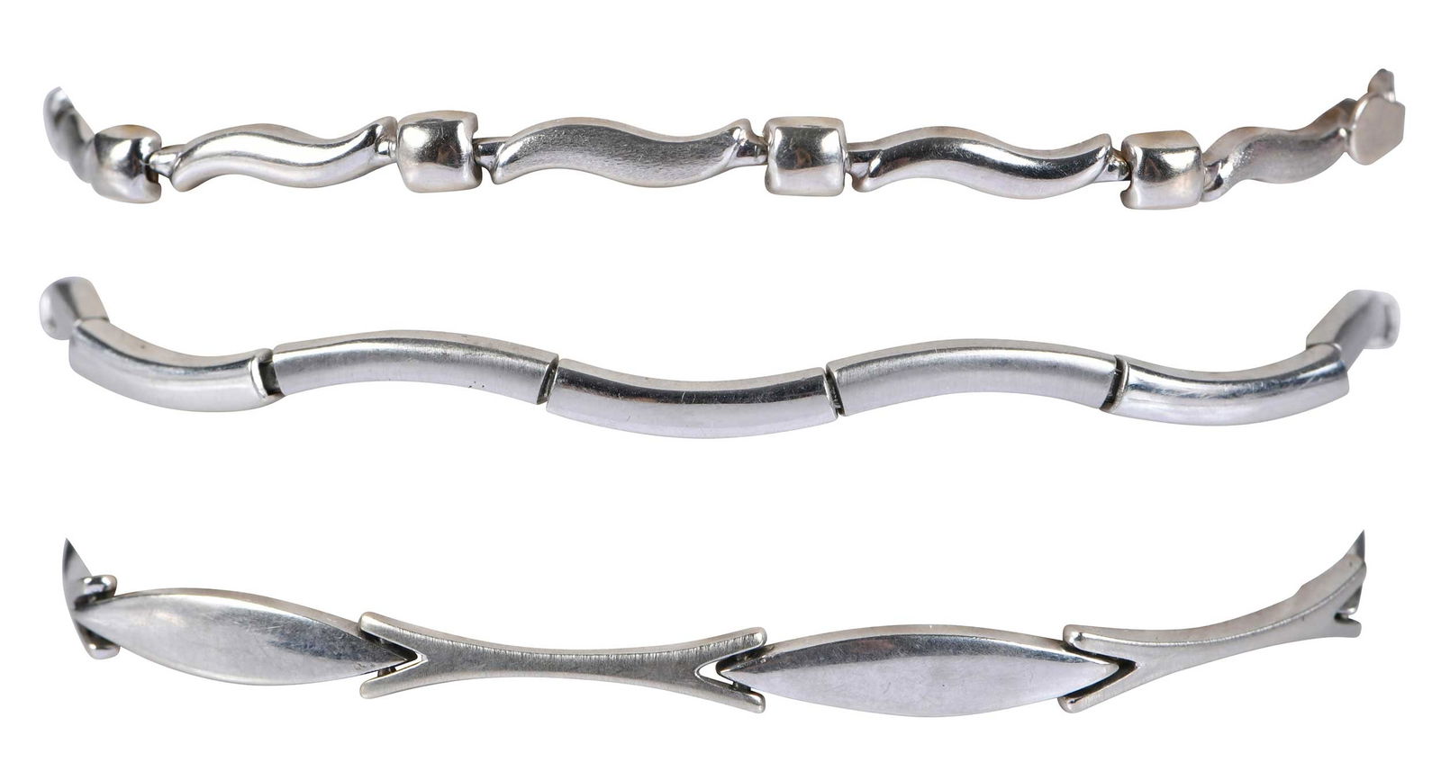Three 14kt. Fancy Link Bracelets: each stamped "14K", white gold, length range 7 to 7-1/2 in.; total weight 21.9 g Provenance: Private Collection Note: Brunk Auctions does not guarantee the accuracy of metal content or purity. All ref