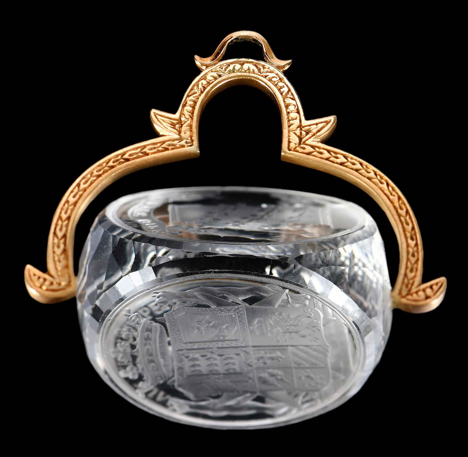 14kt. Three Sided Carved Rock Crystal Watch Fob: large carved three sided spinning rock crystal, tests 14kt. yellow gold, 1-3/4 in. wide, 1-7/8 in. length from bail, 36.5 g Provenance: Private Collection Note: Brunk Auctions makes no warranty or gua