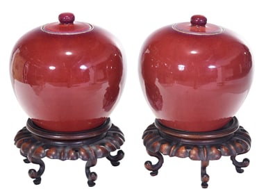 Pair of Chinese Sang de Boeuf Lidded Ginger Jars with Stands