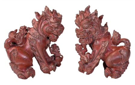 Two Chinese Carved and Red Painted Wood Foo Dogs