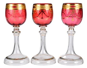 Nine Pieces of Cranberry and Gilt Stemware