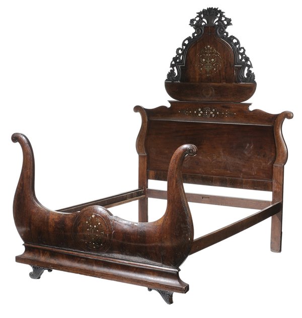 Empire Brass and Mother-of-Pearl: Inlaid Walnut-Veneered Sleigh Bed Continental, possibly Spanish, 19th century, walnut and mahogany, 90 x 67 x 77 in., scattered losses and distress to brass and mother-of-pearl inlay, some cracks and 