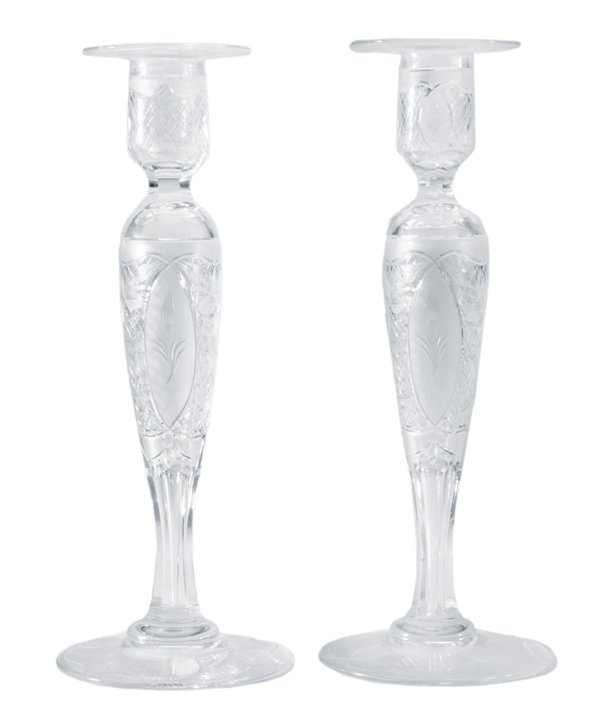 Pair Fine Intaglio-Cut Clear Glass: Candlesticks British or American, early 20th century, fine cut and intaglio decoration, panels with floral bouquets, 10-3/4 in., excellent condition, minor wax residue. Provenance: Estate of Lena Hair