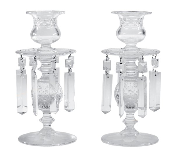 Pair Intaglio-Cut Candlesticks: British or American, late 19th century, cut glass thistle-form socket over drip plate hung with prisms, baluster with spherical bubble form, circular bases with intaglio-cut petaled flowers, each 9-1/
