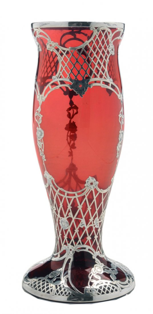 Cranberry Silver Overlay Glass Vase: American, 20th century, floral and basket-weave overlay, partial mark "999/1000", no monogram, 10 in., good condition, light scratches. Provenance: Estate of Lena Haire, Mocksville, North Carolina.