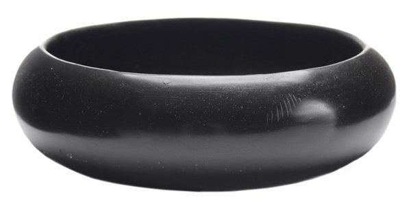 San Ildefonso Blackware Potter Bowl: Southwestern US, 20th century: shallow bowl, signed "Maria", 2-1/2 x 9 in., interior and base discoloration.