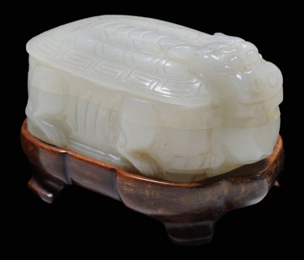 Carved White Jadeite Fitted Box: Chinese, 19th century, lidded box with wooden stays, lid and base with integrated carving of dragon and turtle, 1 x 2-3/4 in., minor internal fracture. Provenance: Piedmont North Carolina Collection.