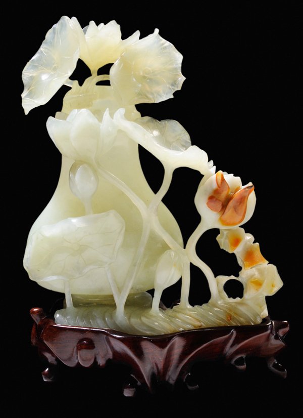 Carved Hardstone Vase and Lotus: Chinese, 20th century, bowenite serpentine in translucent uniform green with dark rust patches, carving on front only of [hu]-shaped lidded vase with lotuses rising from a lotus pond, 6-1/4 x 5-1/4 in