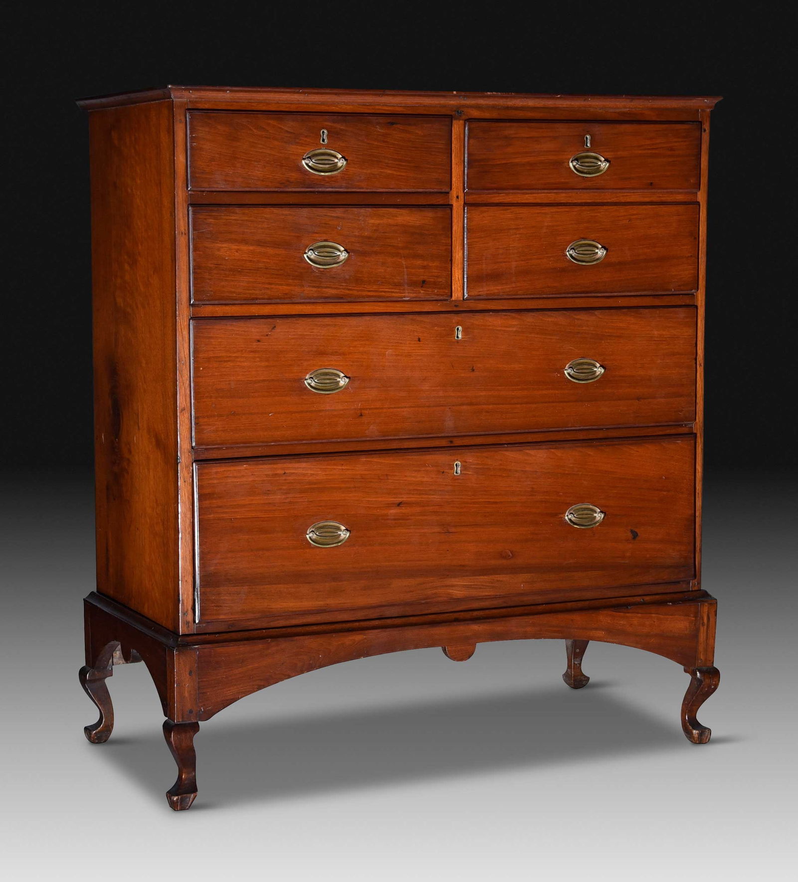 Fine North Carolina Federal Walnut Chest on Frame: Rowan County, early 19th century, yellow pine secondary, mellow old surface, five thumbnail molded drawers including false double drawer, the case on original arched frame with pendant drops and cabri