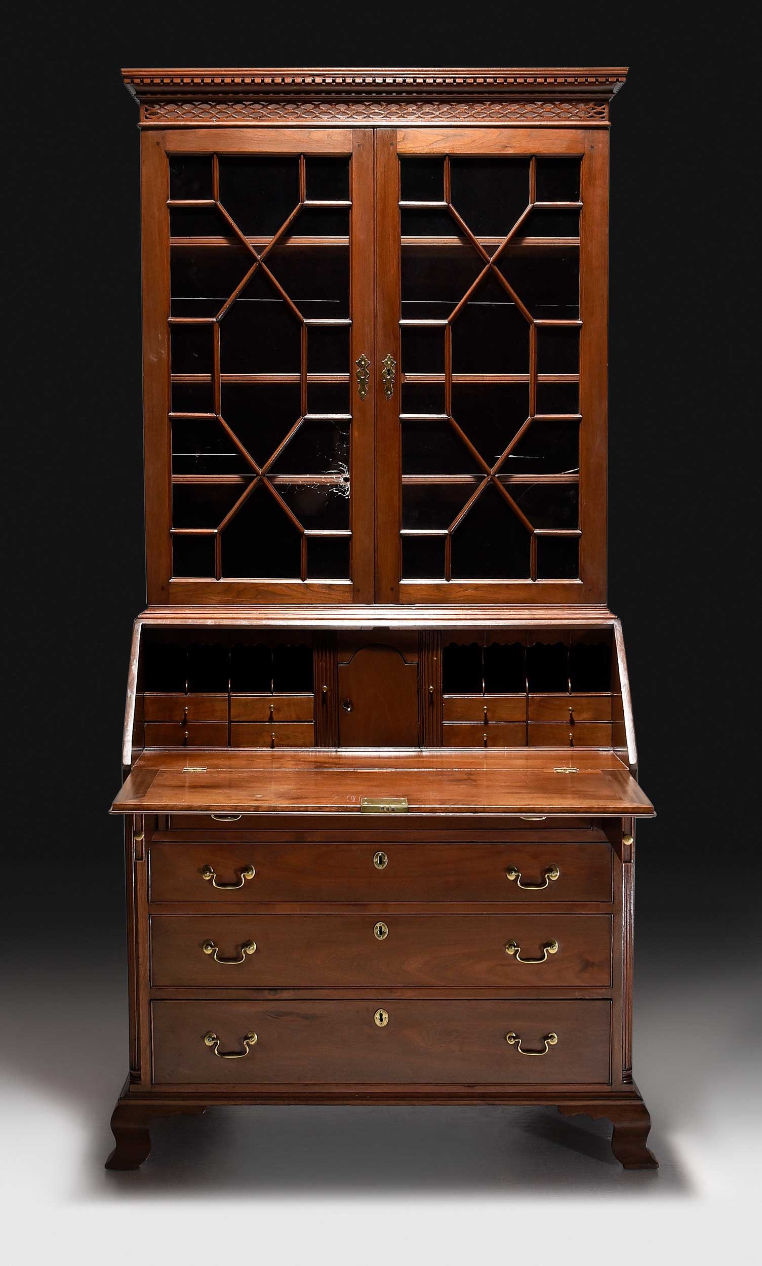 Important MESDA Documented Virginia Chippendale Walnut Secretary Bookcase: attributed to the Winchester area, Virginia, late 18th century, yellow pine secondary, upper case with dentil and pierced pediment over two glazed doors opening to an adjustable shelved interior, lowe