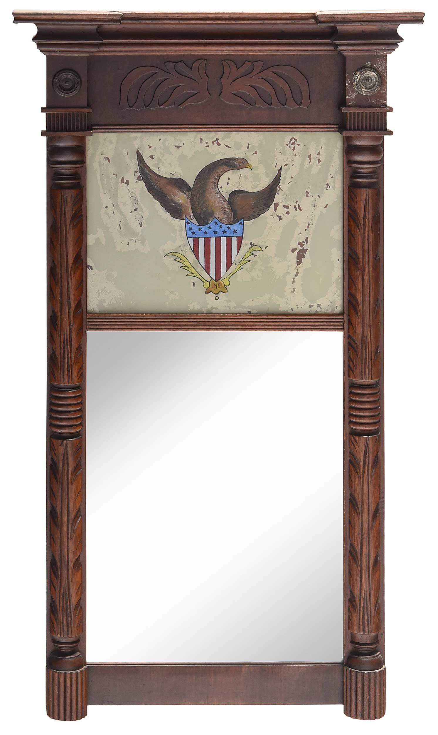 American Classical Mahogany Eglomise Mirror with Great Seal of United States: 19th century, carved frame, brass roundels, reverse painted panel with Great Seal of United States, 33 x 18-1/2 x 3-1/4 in. Provenance: Estate of Joe and Betsy Byerly, Greensboro, North Carolina
