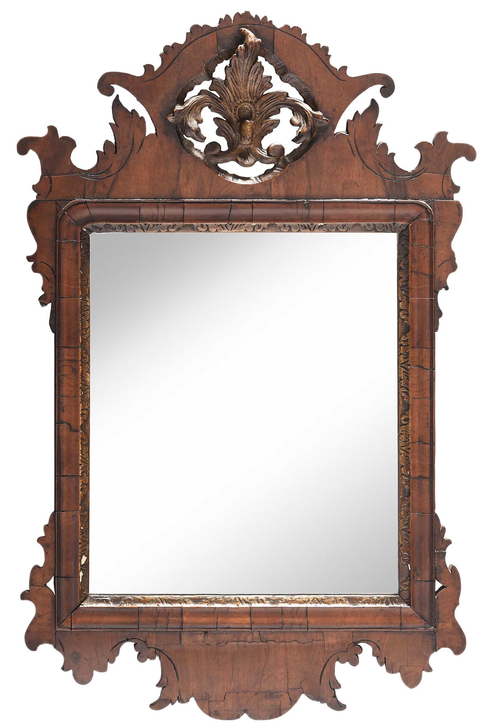 Chippendale Figured Walnut Parcel Gilt Mirror: 18th century, burl walnut veneer on pine frame with parcel gilt trim, the pierced crown carved with gilt acanthus leaf, scratch carved accent, 29-1/2 x 19 x 1-1/4 in. Provenance: Estate of Joe and Bet