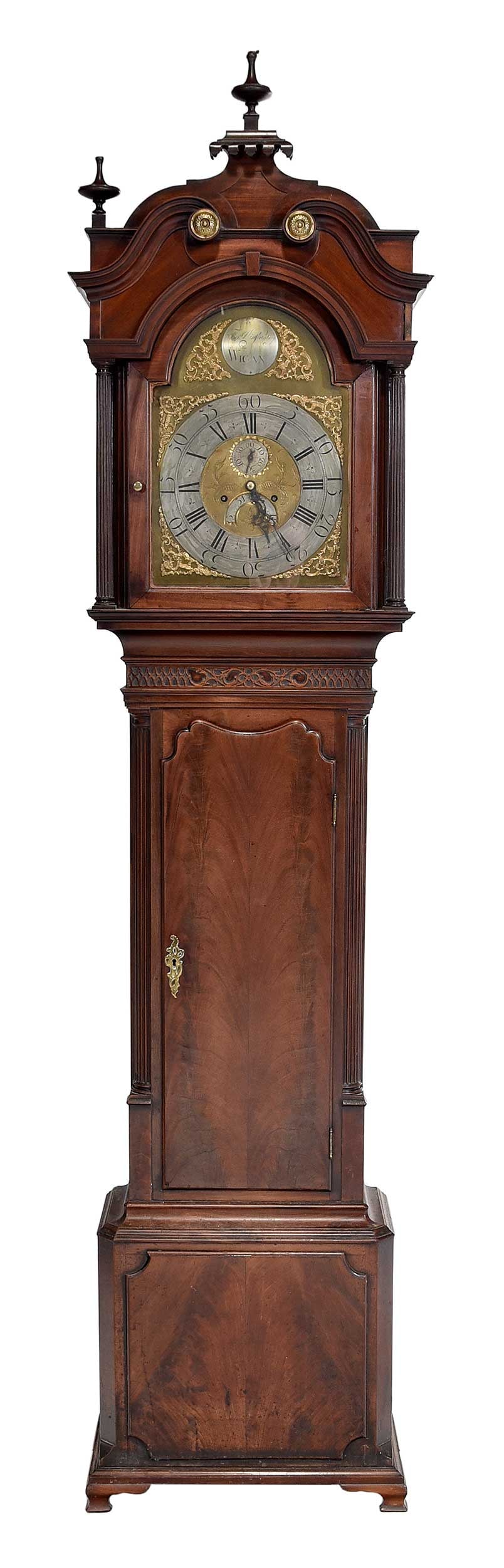 British Chippendale Thomas Winstanley Mahogany Tall Case Clock: Wigan, late 18th century, oak and pine secondaries, engraved brass face with calendar wheel and seconds sweep, roundel engraved with maker and "WIGAN", brass movement, figured mahogany waisted case wi