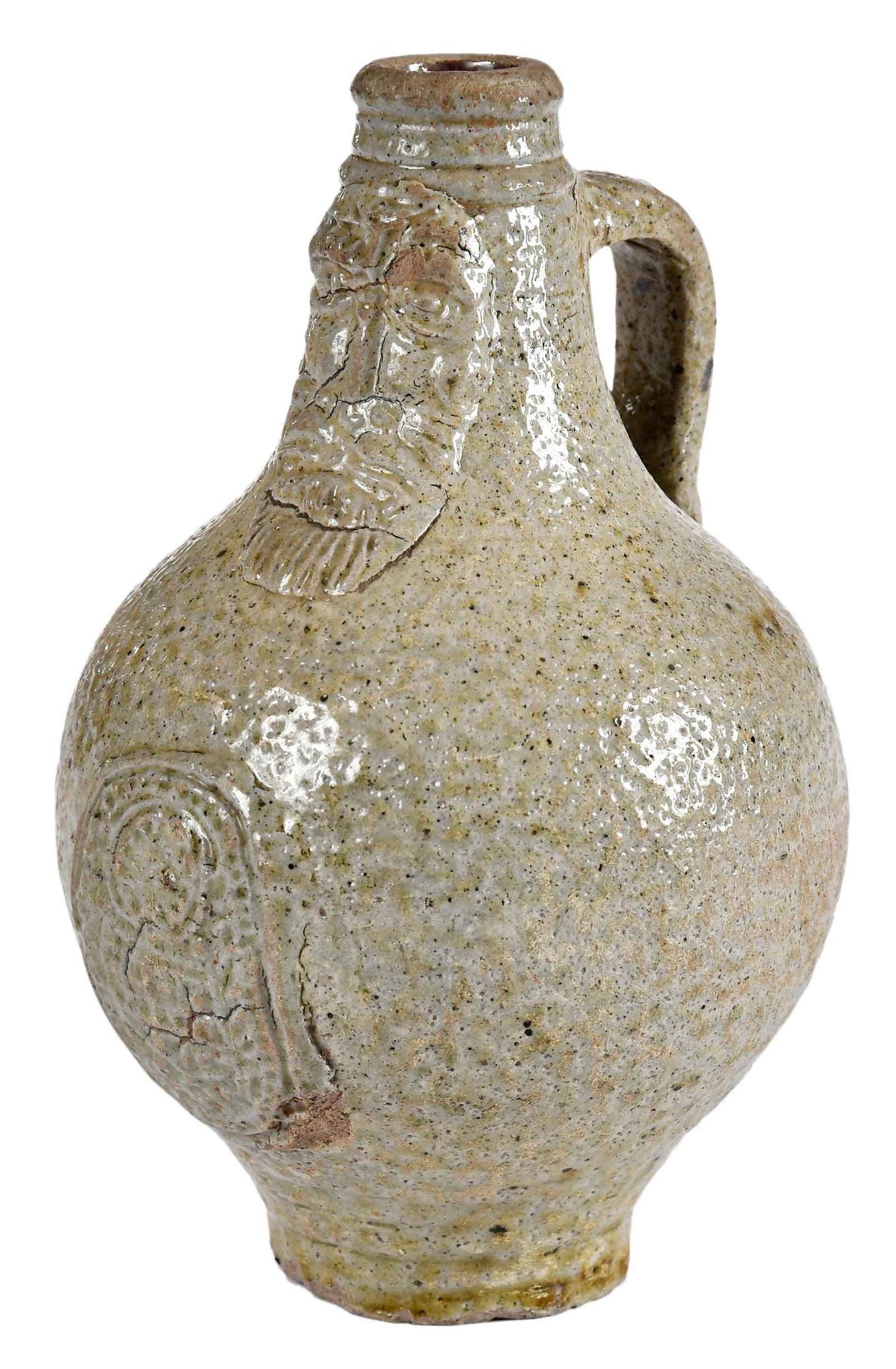 Small Salt Glazed Bellarmine Jug: German, 17th/18th century, bartmann or "bearded man" jug with medallion, 6-3/8 x 4 x 4-1/4 in.Provenance: Estate of Joe and Betsy Byerly, Greensboro, North Carolina