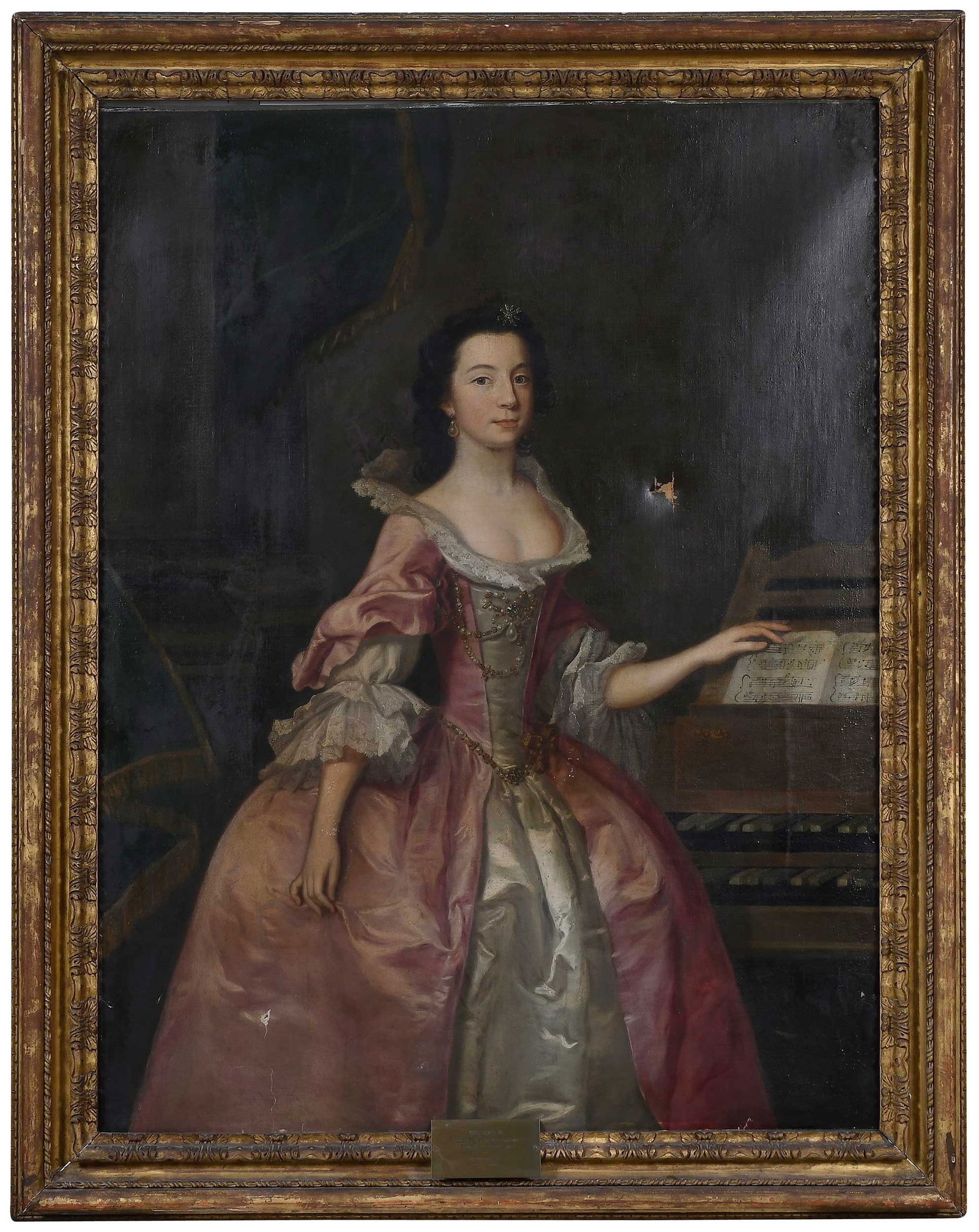 Attributed to Joseph Highmore, Miss Chaplin: (British, 1692-1780) The daughter of Sir John Chaplin of Tothwell, Lincolnshire, shown three-quarter length in a satin gown, wearing jewels, and standing near a double keyboard harpsichord, unsigned,