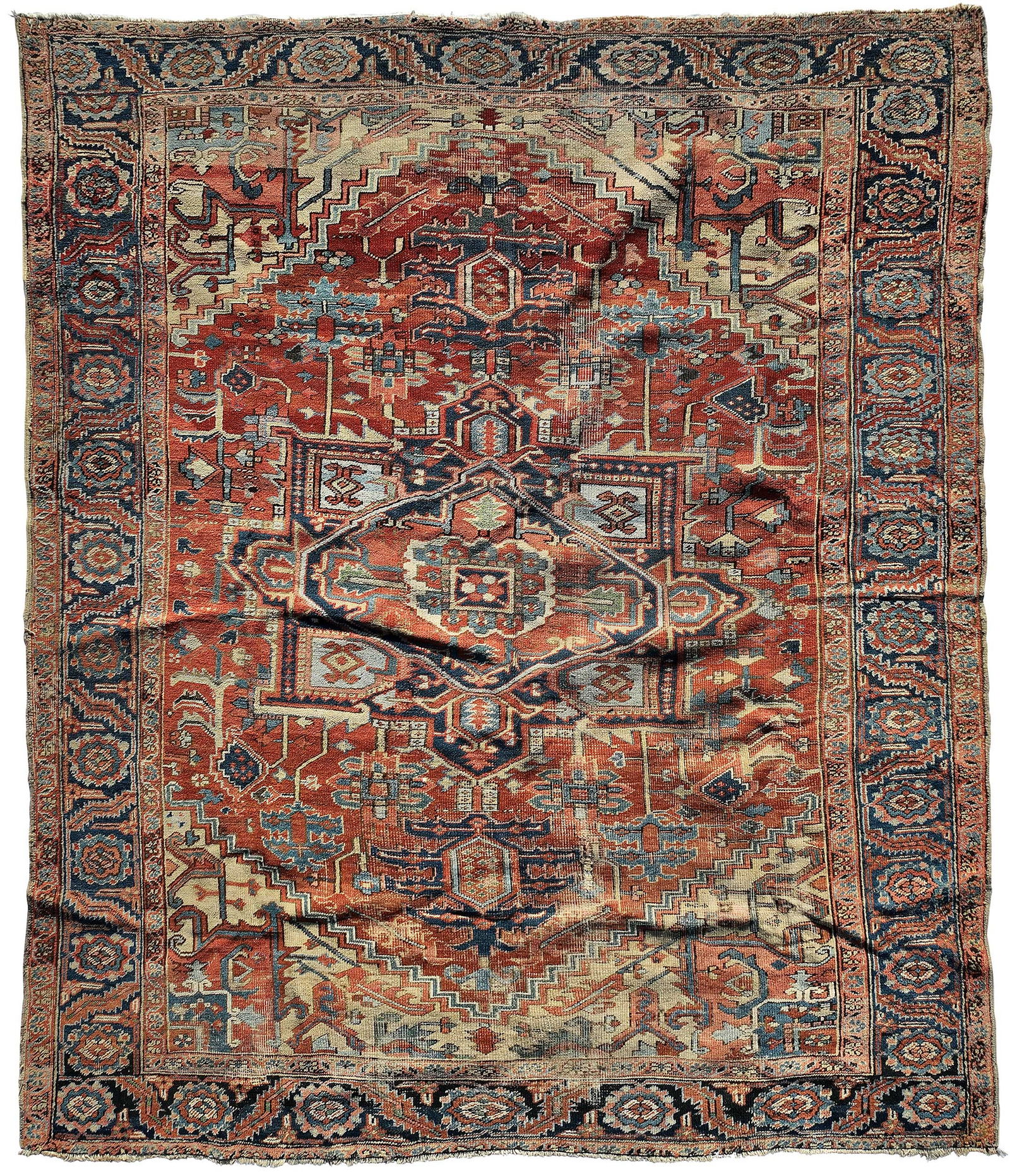 Heriz Carpet: central medallion on red ground, blue main border with single guards, 10 ft. 1 in. x 8 ft. 10 in.Provenance: Private Atlanta Collection