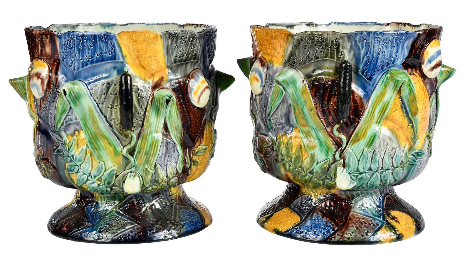 Pair of Italian Majolica Polychrome Planters: late 18th/19th century, one impressed "TS" on base, molded lily decoration, each approximately 8 x 8-1/4 x 8 in.Provenance: Property From An Important Estate, Maryland 
