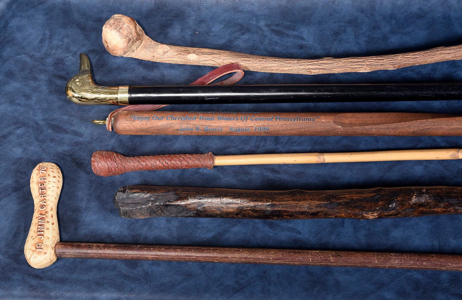 Six Carved Wood Canes, Jimmy Carter Provenance: 20th century, including: cane with peanut handle embossed "Jimmy Carter for President 1976," cane inscribed "President Jimmy Carter 'Enjoy Our Cherished Trout Waters of Central Pennsylvania' John R.