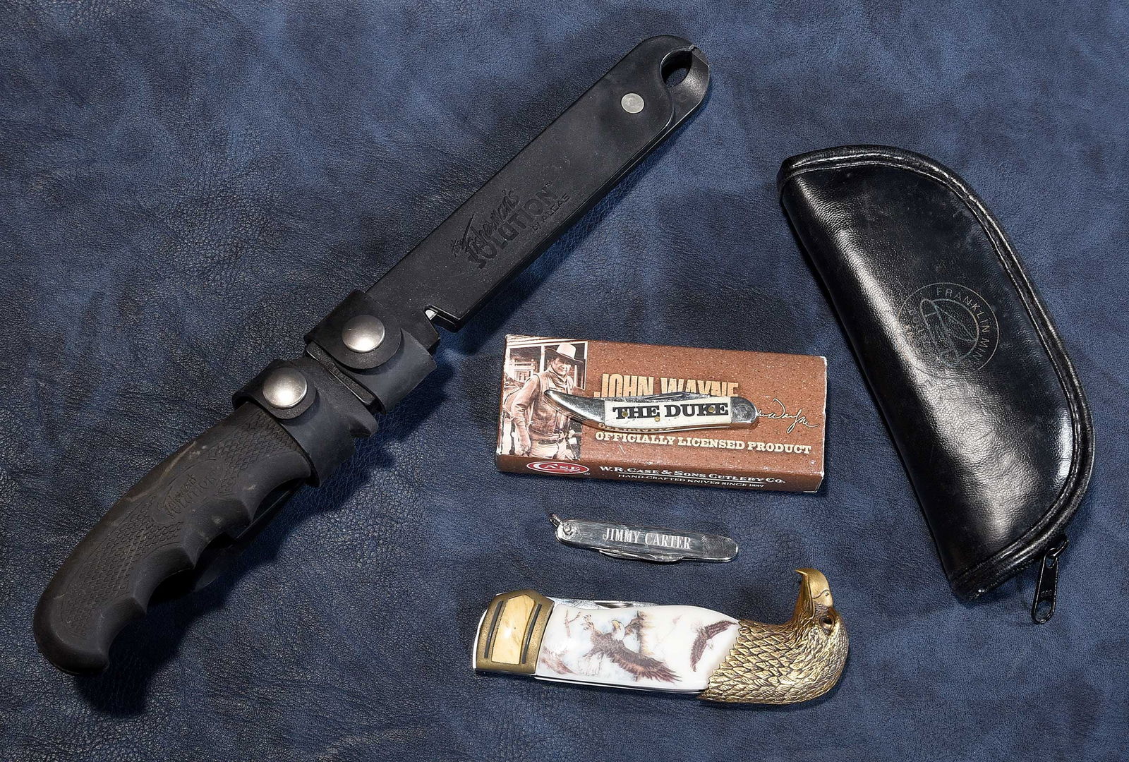 Four Jimmy Carter Owned Knives, One Personalized: American, 20th century, comprising: small sterling pendant knife incised "Jimmy Carter/Spokane June 6, 1974"; John Wayne Case knife; Franklin Mint eagle head knife; The Fisherman's Solution by Alcas f