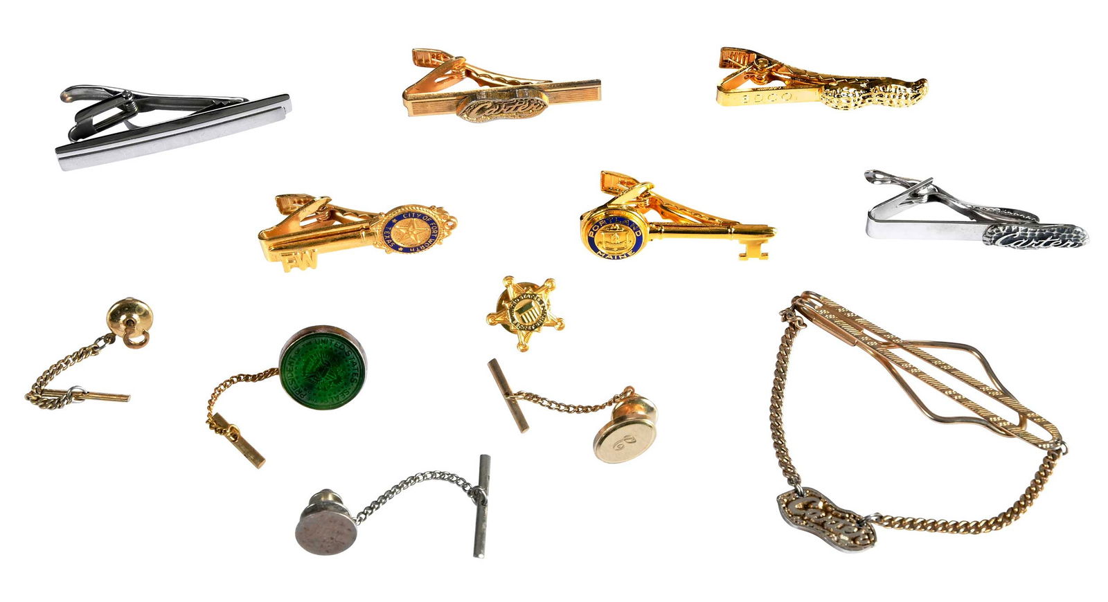 Collection of 12 Various Tie Tacks and Clips, Jimmy Carter Provenance: white tone and yellow tone with various forms, Presidential, Carter, peanut, and Secret Service, related tie tacks and clips Provenance: The Estate of Jimmy and Rosalynn Carter