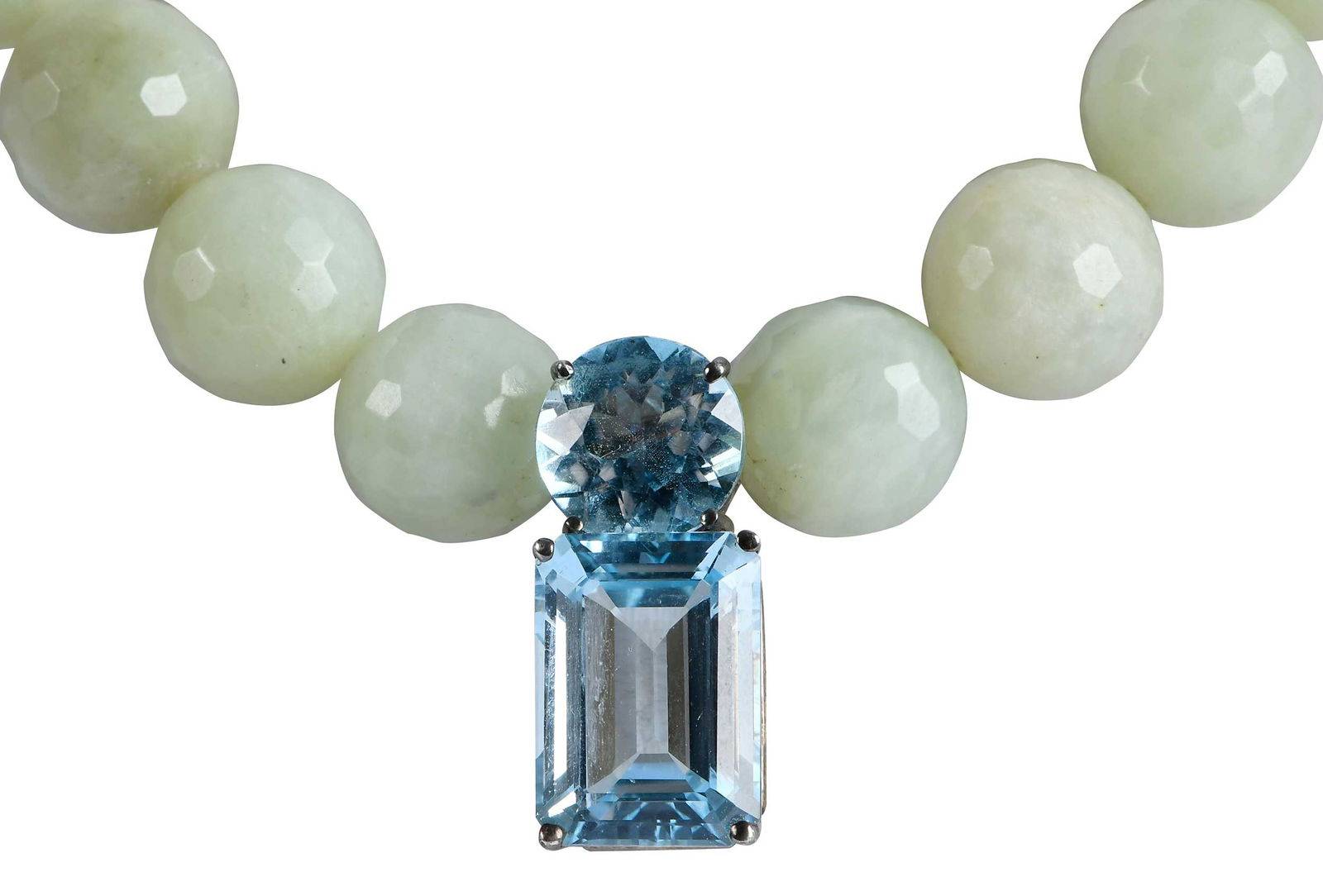 Faceted Jade Bead Necklace with Blue Topaz Pendant, Rosalynn Carter Provenance: 24 round faceted light green Nephrite jade beads, approx. 13.5 - 14.5mm, additional three extra loose beads, four prong set, round full-cut blue topaz, approx. 5.50ct., four prong, emerald cut blue to