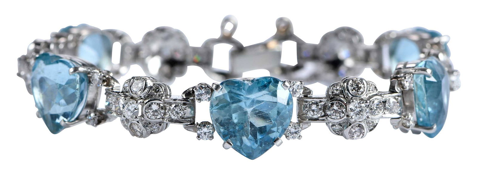 Platinum Heart Shaped Aquamarines and Diamond Bracelet, Bush Family Provenance: five heart brilliant cut aquamarines, approx. 25.00ctw., 90 round full and single cut diamonds, approx. 3.00ctw., tests platinum, 6-5/8 in. length, 26.2 g Provenance: Estate of Flora Bush Jansing, Fir