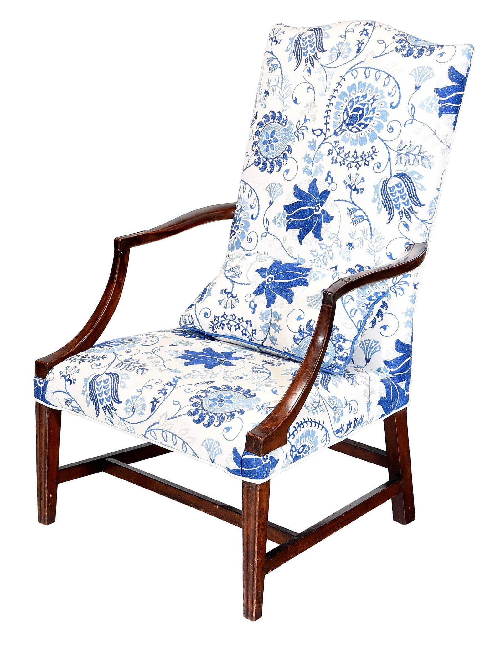 New England Federal Mahogany Lolling Chair: late 18th/early 19th century, old surface, embroidered blue on white floral motif upholstery, the arms carved with small rosettes, 42-1/2 x 25-3/4 x 28 in., seat height 15-1/2 in. Provenance: Private
