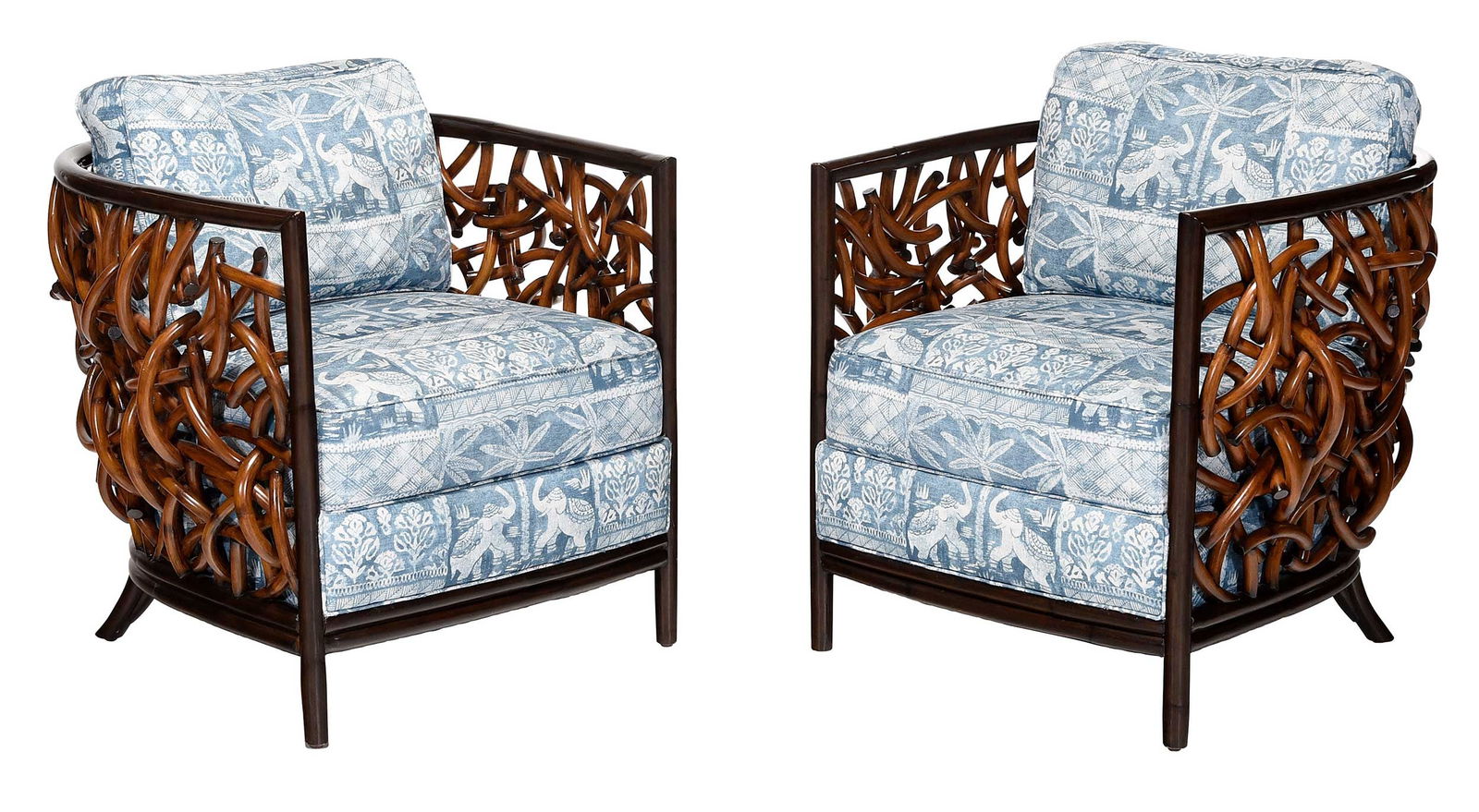 Pair of Palecek Auburn Lounge Chairs: 21st century, pole rattan frames, fixed seat cushions and loose back cushion with printed blue on white Indian Elephant motif, 29-3/4 x 34 x 34 in., seat height 20 in.Provenance: Private Collection,