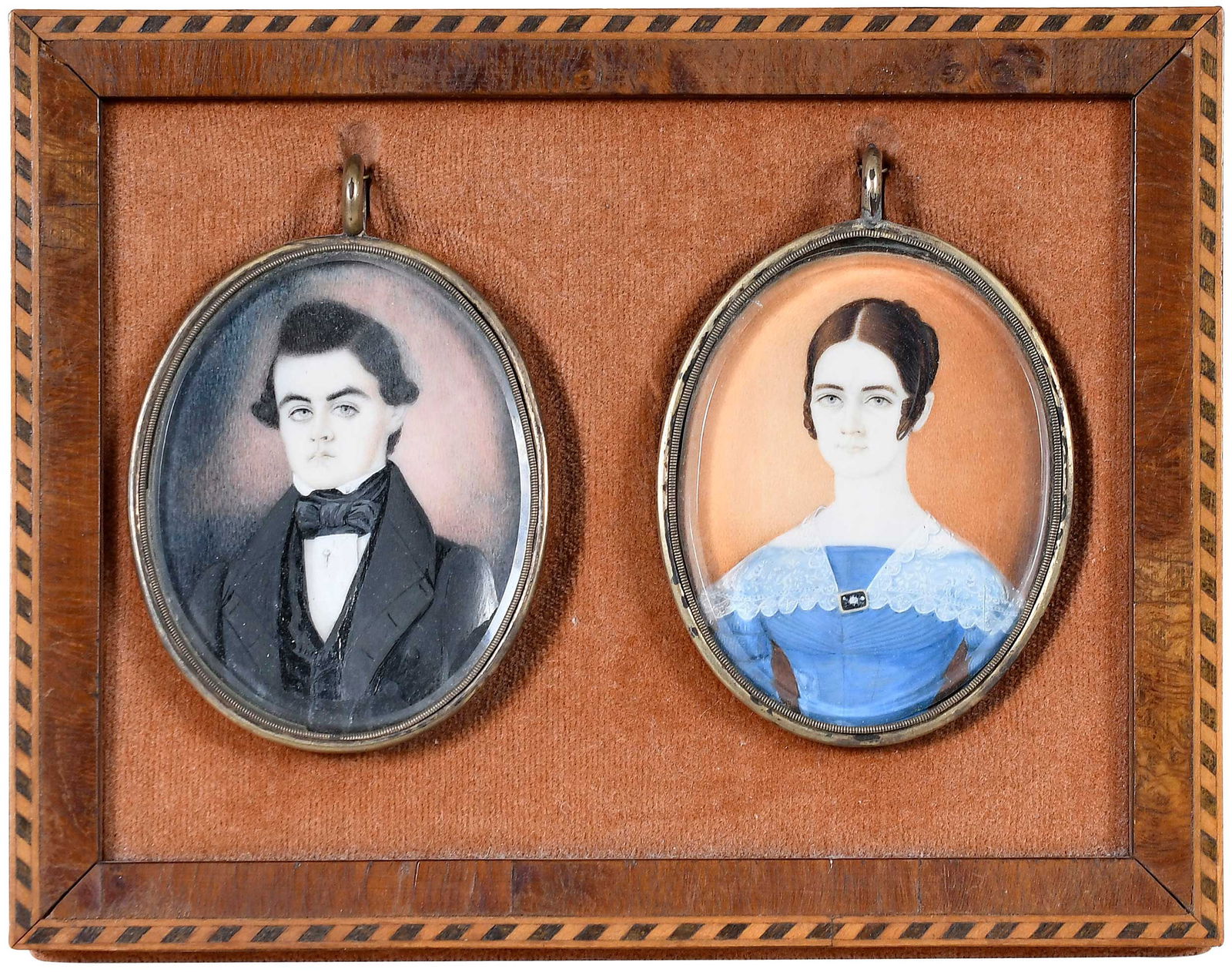 Henry Walton Pair of Early Miniatures: (American, 1804-1865) Portrait of a Young Couple, circa 1825, signed verso (but currently unreadable in sealed frames), watercolor on ivory, each 2-1/2 x 2 in. ovals; original oval metal miniature fra
