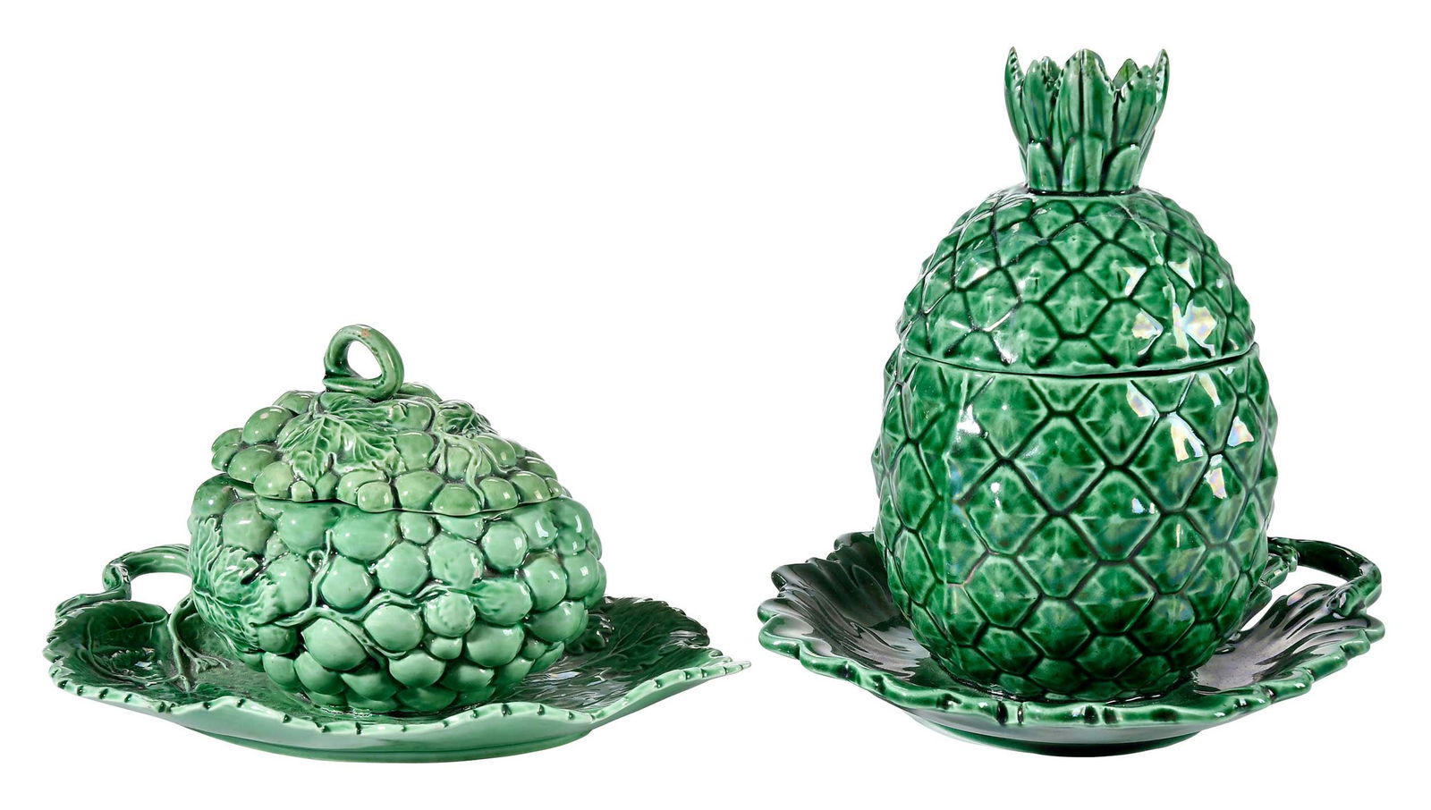 Two Staffordshire Earthenware Fruit Form Tureens, Grapes and Pineapple: circa 1785, each with molded underplate, larger 7-1/4 x 8 x 7 in. Provenance: (pineapple and grape) Liza and Wallace Gusler; (pineapple) Root Collection (label); Skinner, (pineapple) Boston, European