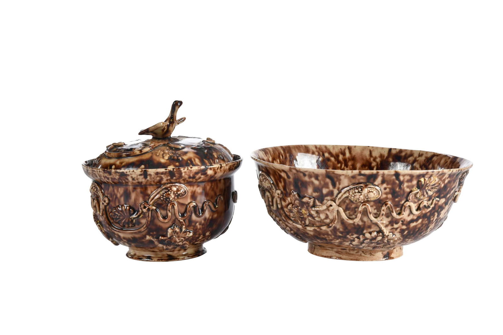 Two Staffordshire Whieldon Type Tortoiseshell Bowls: 18th century, molded vine and leaf decoration, one lidded with bird finial, 3-3/4 x 4-1/8 x 4-1/8 in. and 2-1/2 x 5-5/8 x 5-5/8 in. Provenance: (lidded bowl) Rous Lench Collection; Earle Vandekar, New