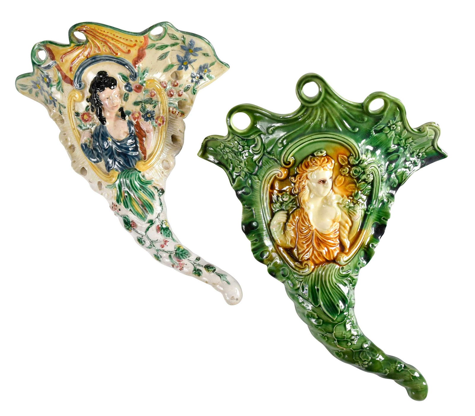 Two English Polychrome Wall Pockets: 18th century, both with an impressed woman in central cartouche with foliate motifs, larger 11-3/4 x 8-5/8 x 3-3/8 in. Provenance: Collection of Dr. Richard and Carol Lamb, Kennett Square, Pennsylvani