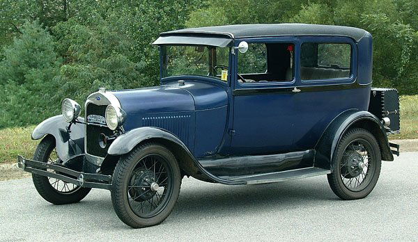 1928 Ford Model A two-door sedan,: 1928 Ford Model A two-door sedan, original four-cylinder engine, fully restored, good running condition. Repainted (blue), recently rebuilt engine, replaced exterior trunk, new vinyl top, several rust