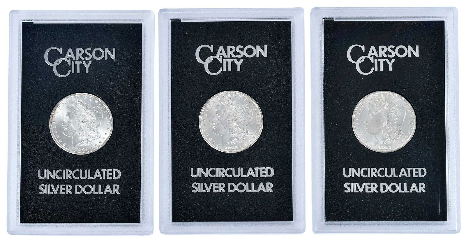 Three Carson City Morgan Dollars: 1882, 1883, and 1884: in GSA cases (no outer box or COA) Provenance: Private Collection, Lincolnton, North Carolina