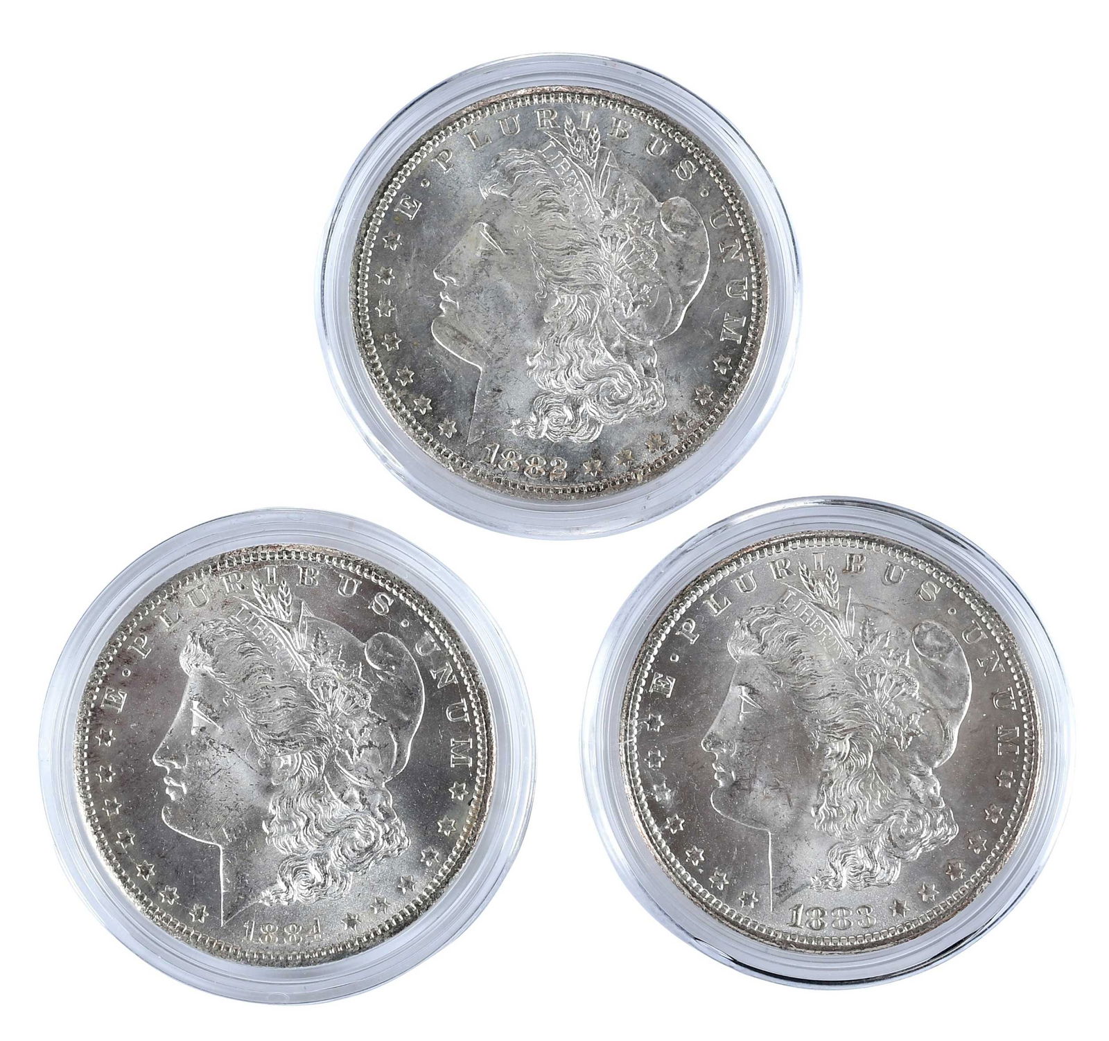 Three Carson City Morgan Dollars: 1882, 1883, 1884 in Capsules: Carson City dollars Provenance: Private Collection