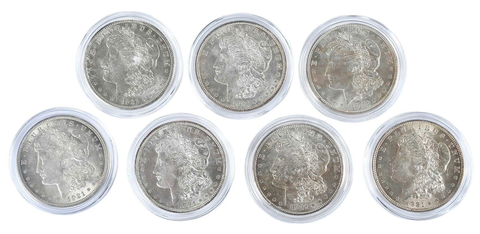 Seven 1921 Morgan Dollars in Capsules, Uncirculated: some with mintmarks Provenance: Private Collection