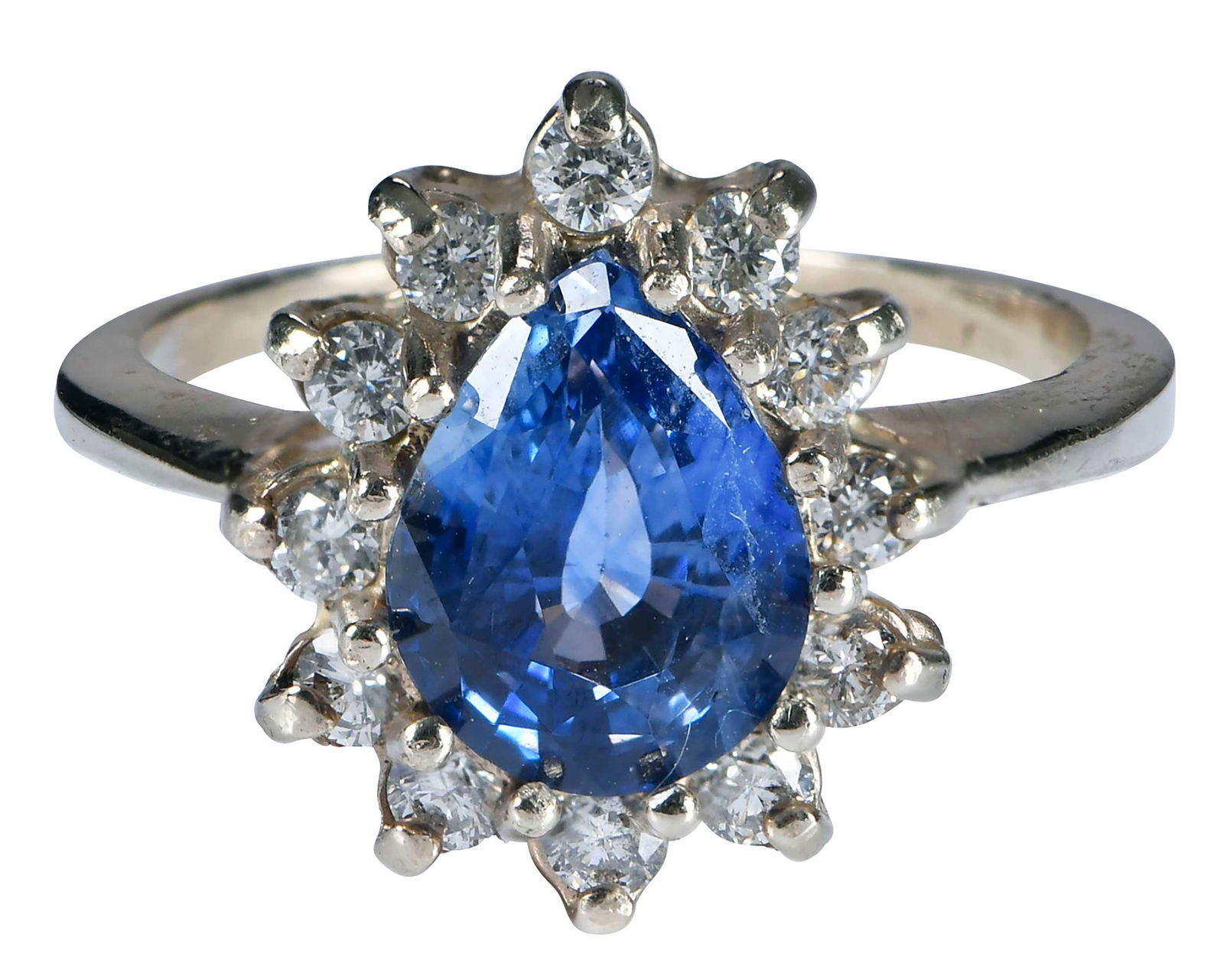 14kt. Blue Sapphire with Diamond Halo Ring: pear brilliant cut blue sapphire, approx. 2.10ct., 12 round full cut diamonds, approx. 0.25ct., marked " 14kt", white gold, 6-3/4 ring sz., 4.3 g Provenance: Estate of Linda Sargent Thompson, Historic