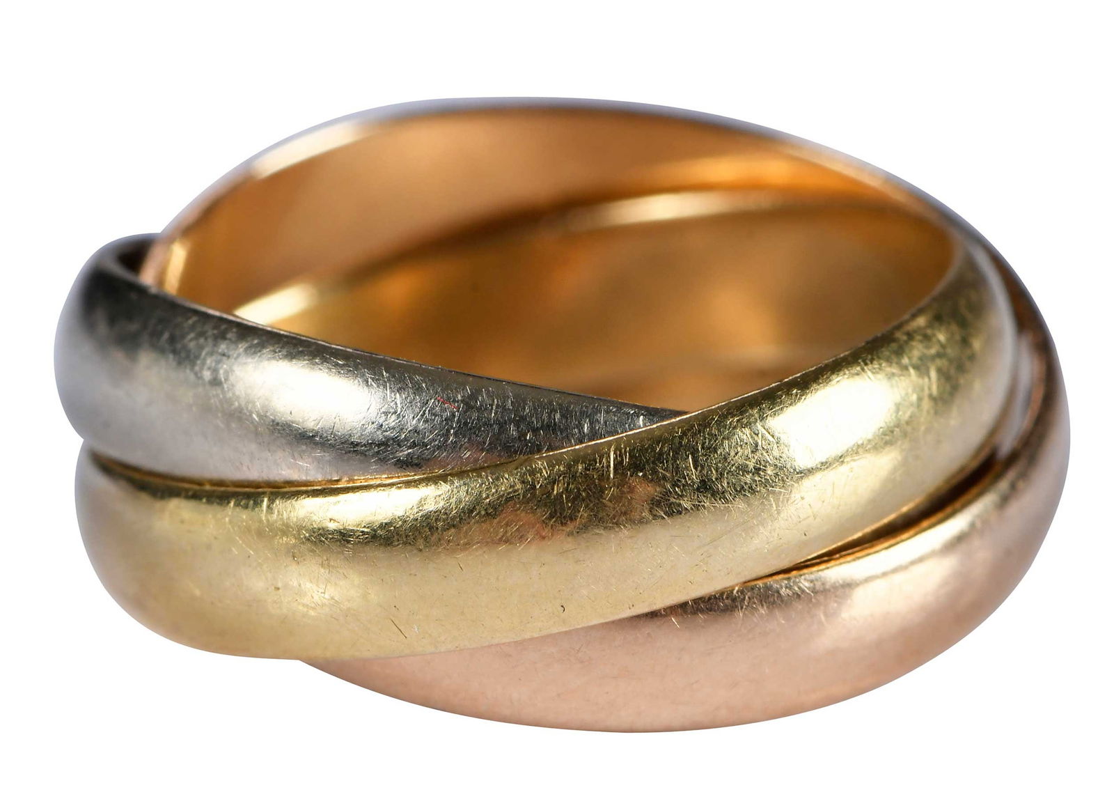 18kt. Cartier Trinity Ring, Classic Model: three intertwined moving rings, high polish, marked "Les Must de Cartier" tests 18kt. white gold, yellow gold and rose gold, 3-1/2 ring sz., 6.6 g Provenance: Private Collection Note: Brunk Auctions d