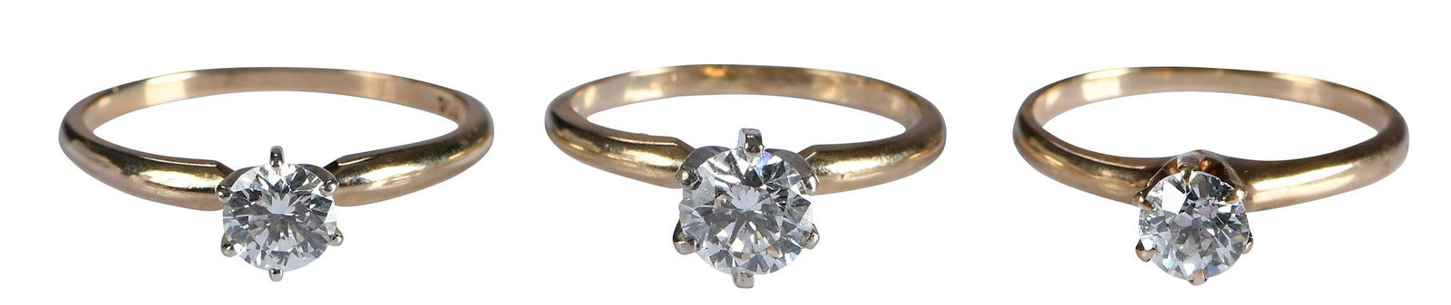 Three 14kt. Prong Set Solitaire Diamond Rings: round brilliant cut diamond, approx. 0.80ct., VS, F-G, marked "14KP", yellow gold, white gold six prong, 5-1/2 ring sz.; round brilliant cut diamond, approx. 0.50ct., VVS, F-G, marked "14K, QDC", yell