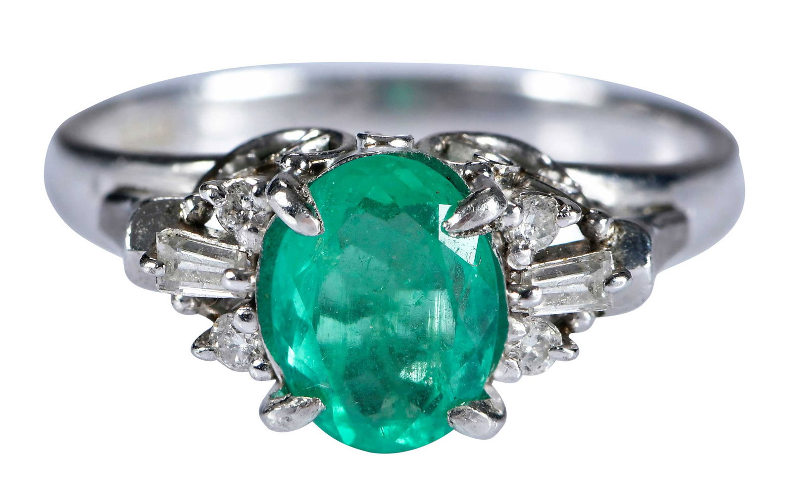 Platinum Vintage Style Emerald and Diamond Ring: oval brilliant cut emerald, approx. 1.00ct., two tapered baguette cut diamonds and four round brilliant cut diamonds, approx. 0.13ctw., marked "Pt900, D13" platinum, 61/2 ring sz., 4.7 g Provenance: E