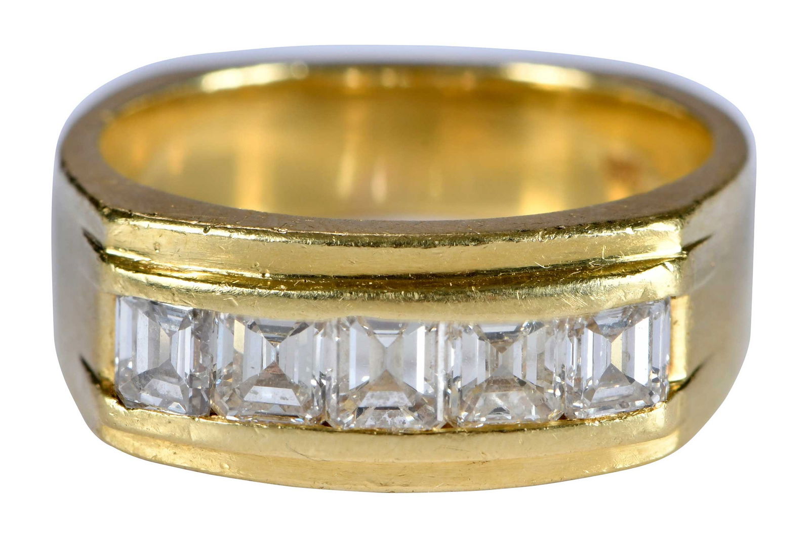 18kt. Men's Cigar Band with Five Asscher Cut Diamonds: channel set, approx. 1.50ctw., VS, G-I, marked "18K" yellow gold, 10-3/4 ring sz., 9.0mm widest, 15.9 gProvenance: The Estate of Timothy B. Johnston, Russellville, ArkansasNote: Diamonds were tested