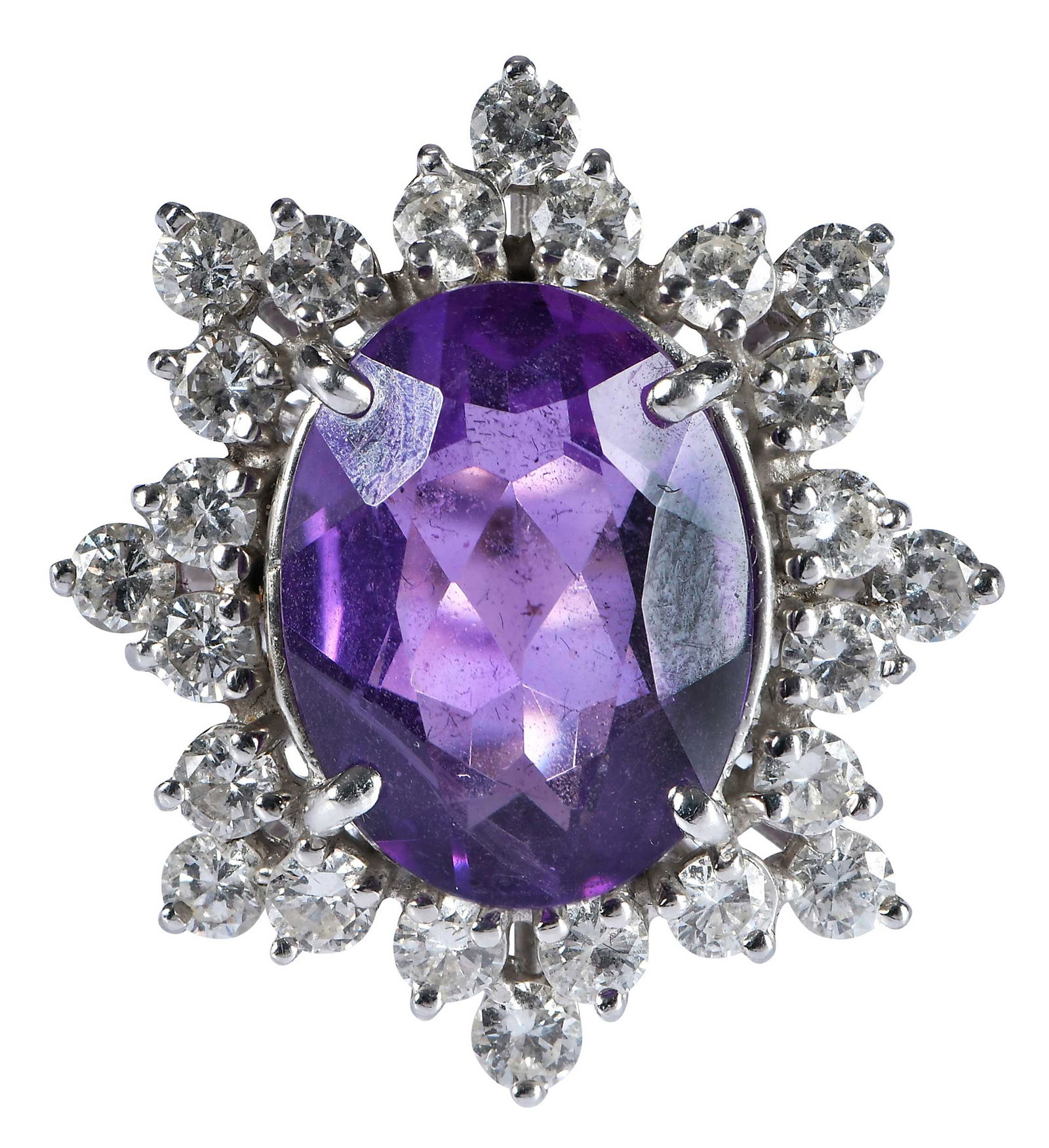 14kt. Amethyst and Diamond Dinner Ring: oval faceted amethyst, approx. 6.50ct., surrounded by 24 round full cut diamonds, approx. 2.25ctw., tests 14kt. white gold, 6-1/4 rings sz., 8.8 gProvenance: Private CollectionNote: Brunk Auctions