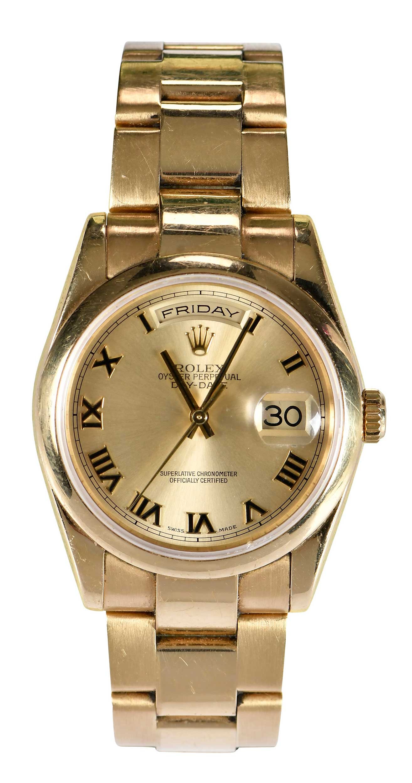 18kt. Day Date Rolex Watch with Box: 36mm, champagne dial, polished gold hands, Roman numeral hour markers, ref #118208, case serial P516277, sapphire crystal, smooth gold bezel, day window at 12 o'clock, date cyclops at three o'clock, 1