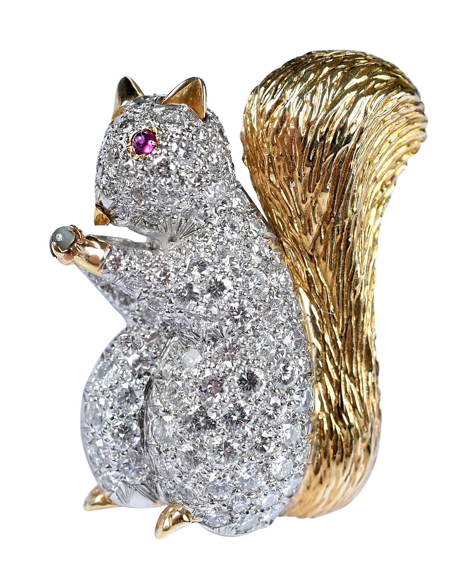 14kt. and Platinum Diamond Squirrel Brooch: pave set round brilliant cut diamonds, cabochon cut ruby eye, cabochon cut jade nut, unmarked, tests 14kt. yellow gold, diamonds set in platinum, 1-1/8 in. length, fur pin, 13.6 gNote: Brunk Auctions
