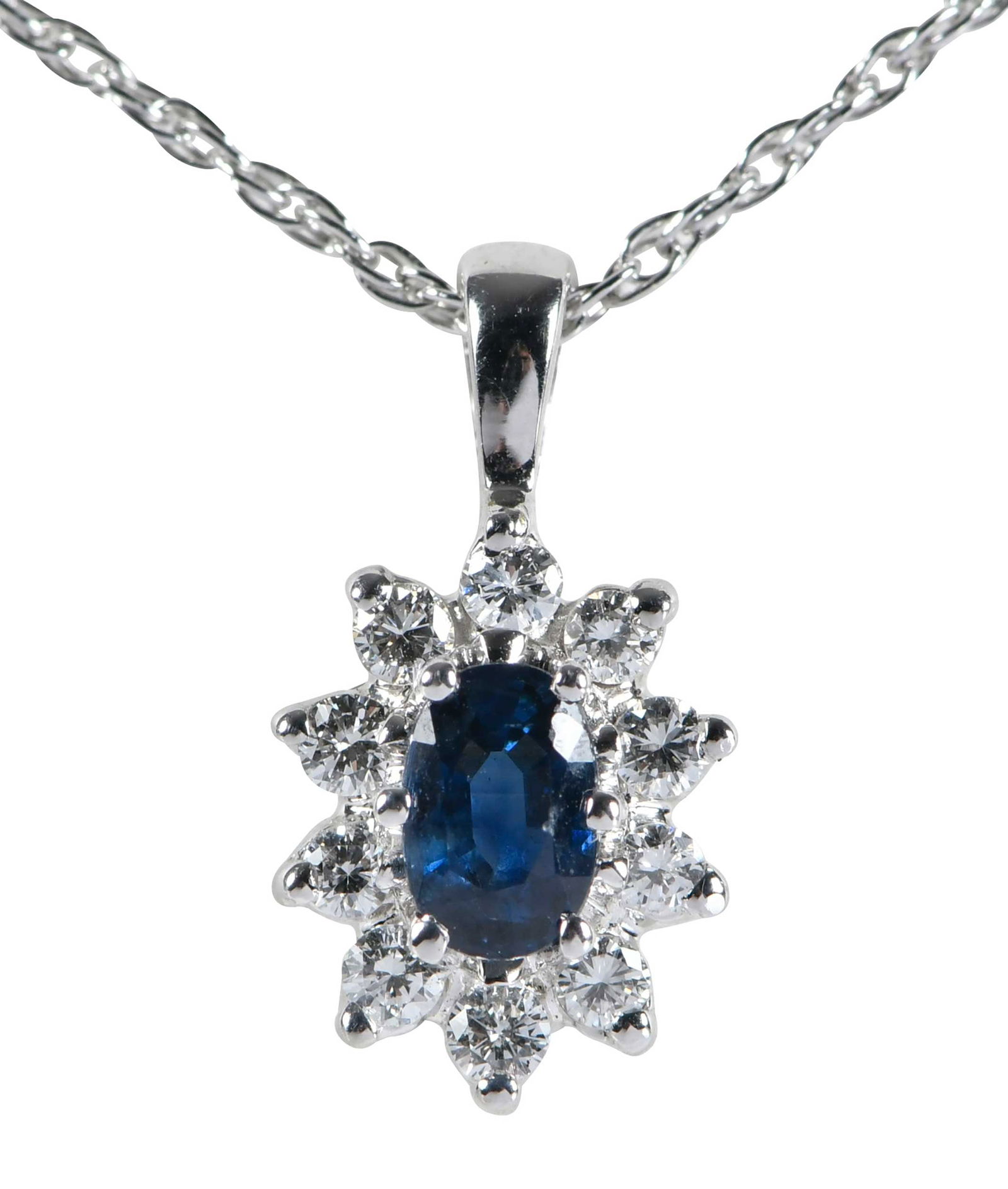 14kt. Classic Blue Sapphire and Diamond Halo Pendant: oval faceted cut blue sapphire, approx. 0.25ct., 10 round full cut diamonds, marked "14K", white gold, 14mm length with bail, rope chain, marked "14K", white gold, 18 in. length, 2.6 g Provenance: Pri