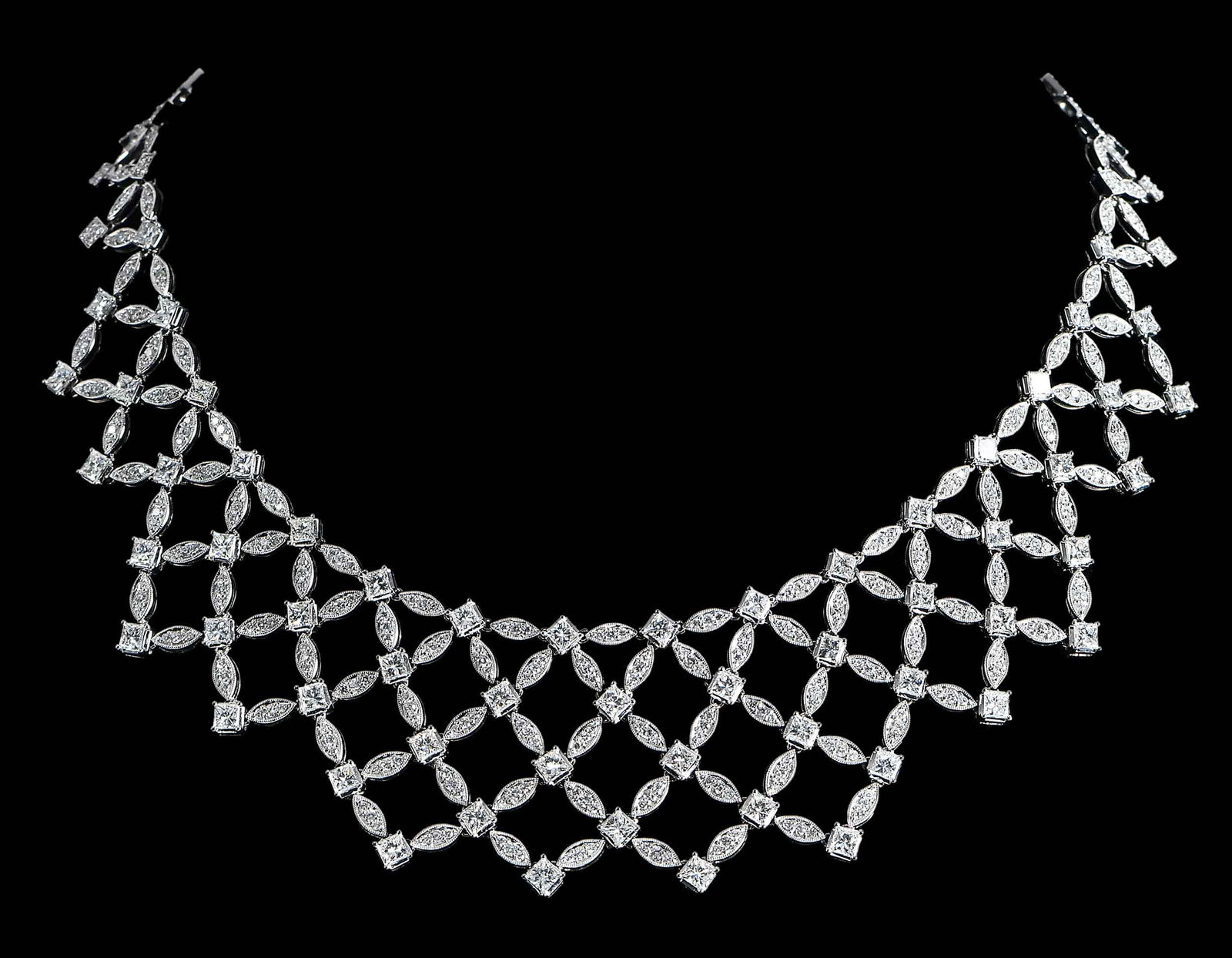 18kt. Statement Diamond Lattice Pattern Necklace: articulated links, round full cut diamonds, square princess cut diamonds, possibly approx. 14.00ctw., VS, H-I, marked "18K", white gold, 16 in. length, 62.1 gProvenance: Private CollectionNote: Some