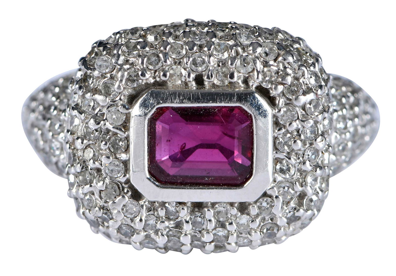 14kt. Garnet and Pave Diamond Ring: rectangular step cut garnet, accented by round single cut diamonds, approx. 0.75ctw., marked "14K", white gold, 7 ring sz., 7.1 g Provenance: Estate of Linda Sargent Thompson, Historic Sesame Lodge, N