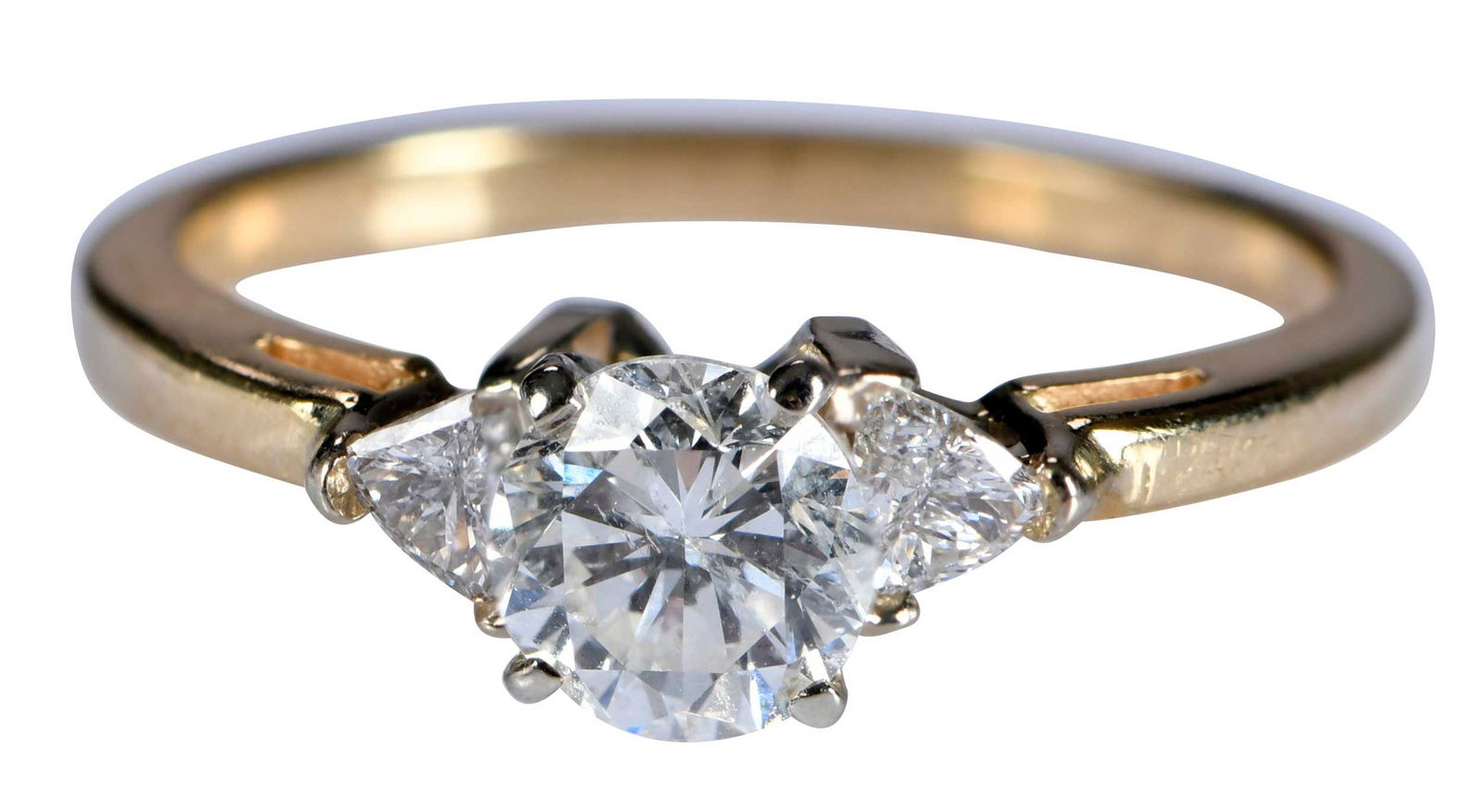 14kt. Diamond Ring with Triangle Diamond Accents: round brilliant cut diamond, approx. 0.75ct., SI, H-I, two triangle cut diamonds, marked "14K", yellow gold and white gold, 6-1/4 ring sz., 2.7 g Provenance: Estate of Linda Sargent Thompson, Historic