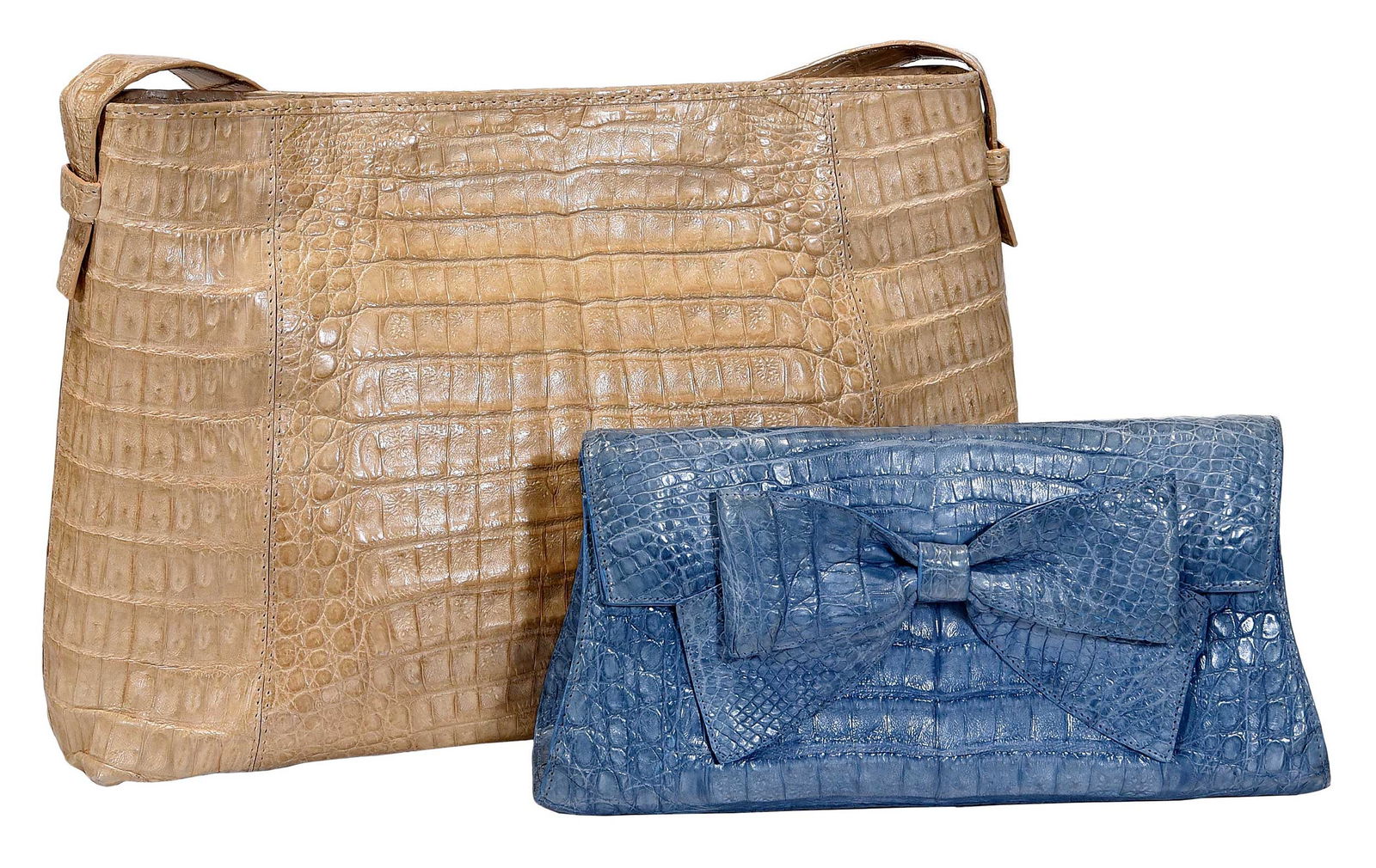 Crocodile Monosac Shoulder Bag and Nancy Gonzalez Clutch: Colombia, cream crocodile shoulder bag with suede interior, 8-3/4 x 13 x 4 in., strap drop 11-1/2 in.; periwinkle crocodile clutch with bow, 4-1/2 x 9-1/2 x 2-1/2 in.Provenance: Private Collection,