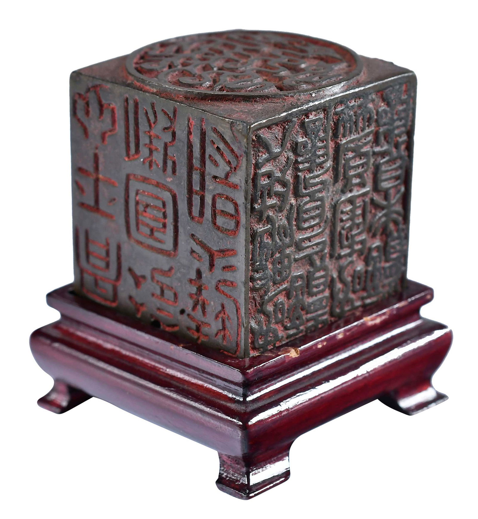 Chinese Bronze Seal Box on Stand: probably late Qing dynasty, 1-1/4 x 1-1/4 x 1-1/4 in., with conforming wood stand, height on stand 2 in. Provenance: The Lifetime Collection of Ronald Elliott Hasbrouck Woodaman (1937-2025), Virginia